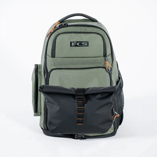 FCS Day X Pack 24L Green and black backpack with FCS logo on a white background
