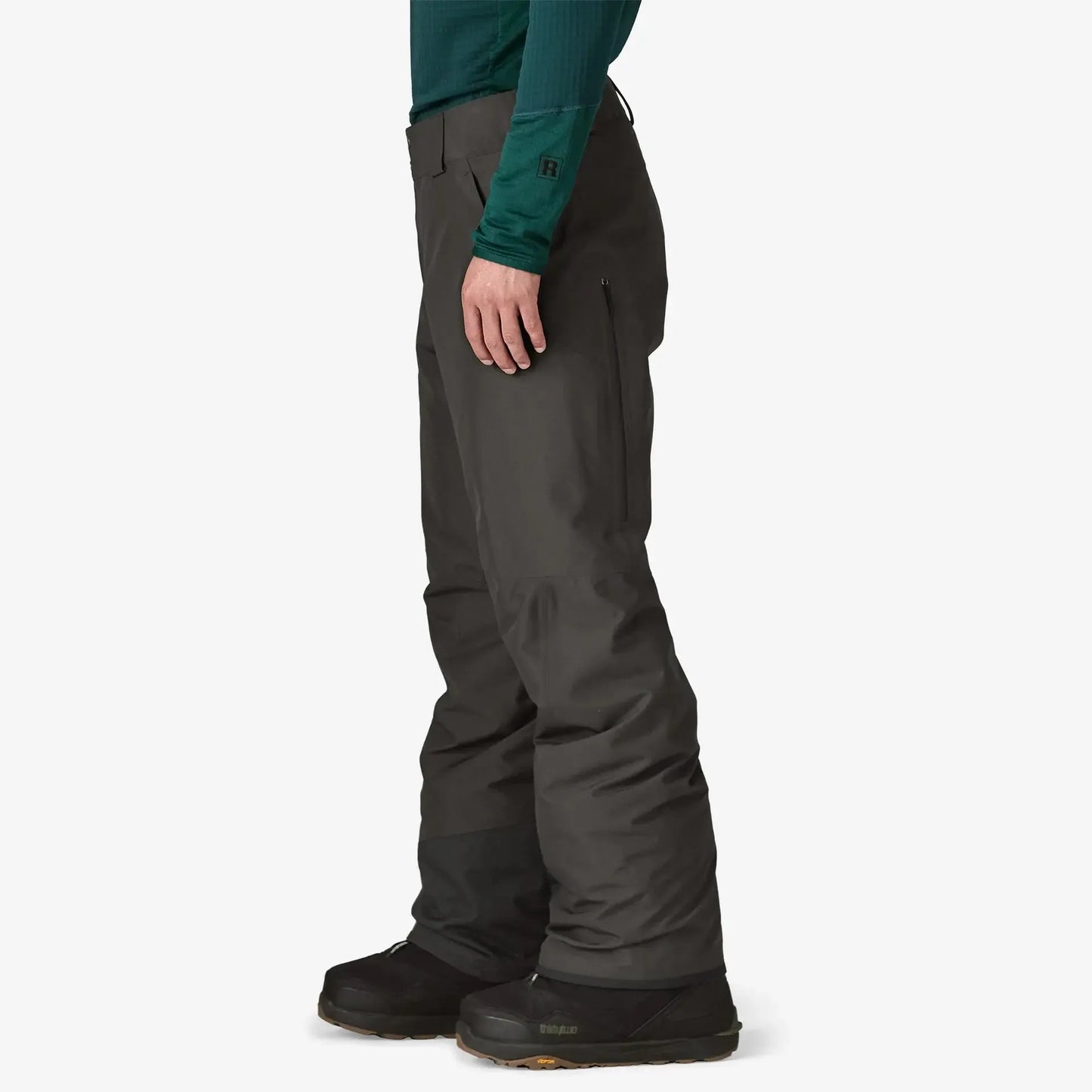 Person wearing dark gray pants on a white background