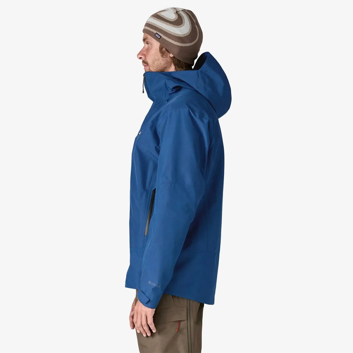 Patagonia Men's Storm Shift Jacket |Person wearing a blue jacket and brown beanie on a white background