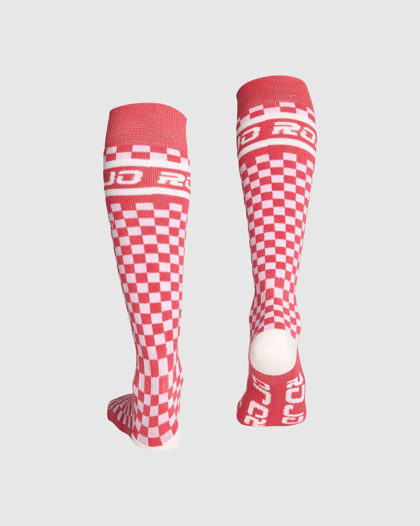 Red and white checkered socks with 'Roces' branding on a light gray background
