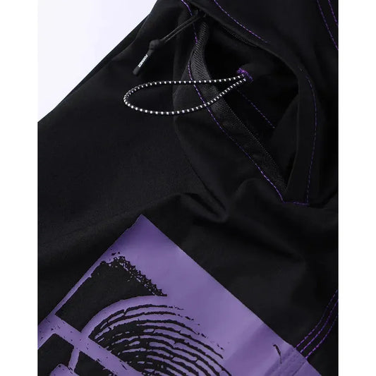 Former x Rage Corpcore 21 Trunks Black boardshorts with purple accents and a purple fabric patch on a white background