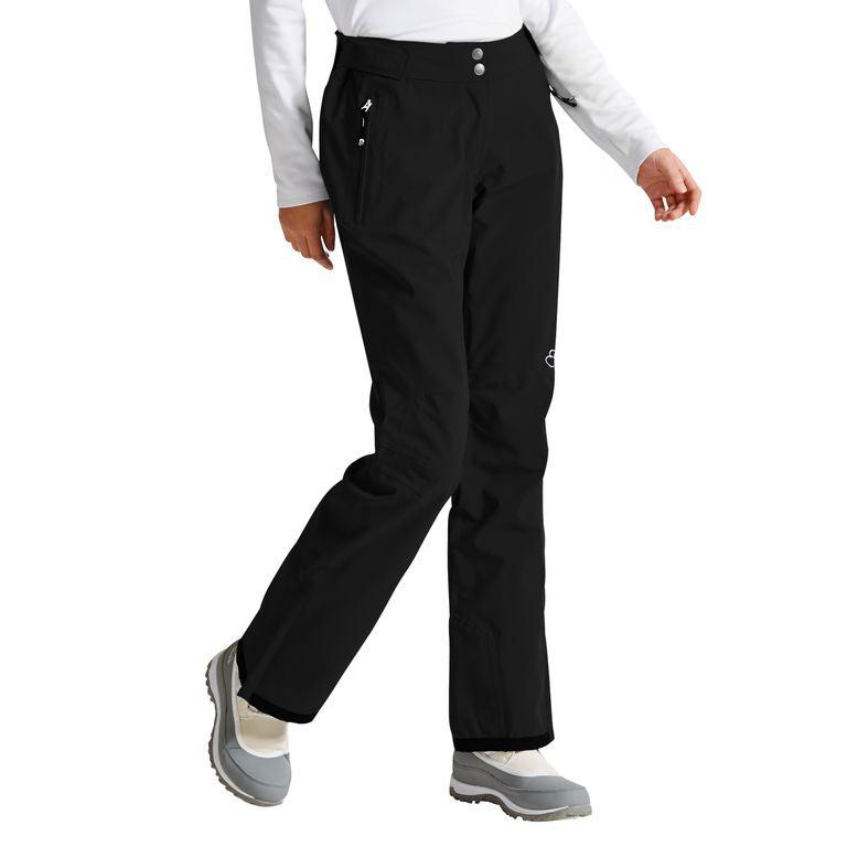 Descente women's black snow pants with zip pockets and white logo, worn with winter boots