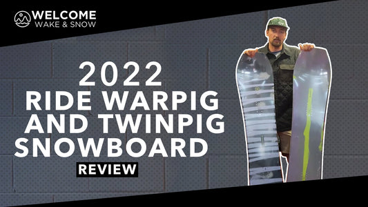 Man holding 2022 Ride Warpig and Twinpig snowboards at Welcome Boardstore review
