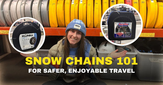 Smiling woman in winter clothing displays snow chains at Boardstore with helmet and gear shelves.