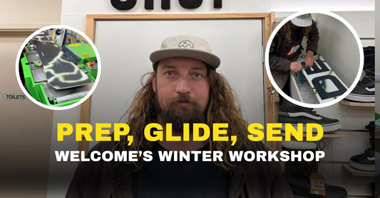 Man at Welcome Boardstore workshop with snowboard tuning, snowboarding gear background