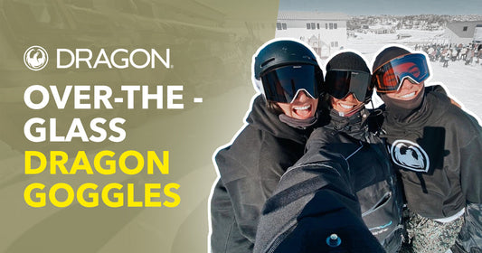 Three snowboarders wearing Dragon goggles smiling on a snowy mountain at a ski resort