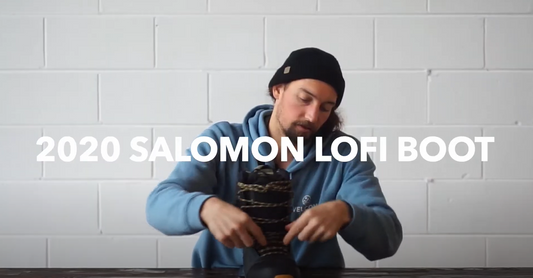 Man in blue hoodie and beanie showcasing 2020 Salomon Lofi snowboard boot at Welcome Boardstore