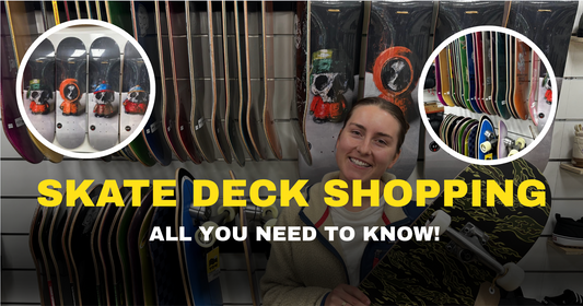 Smiling woman holding skateboard in board shop, skate decks displayed on wall, text: Skate Deck Shopping All You Need To Know.