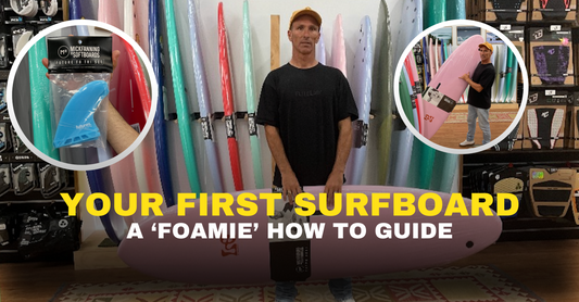 Beginner surfboard guide with man holding pink foam surfboard, surf fins, and surf gear display