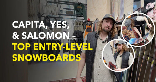 Man in snowboard shop showing Capita, YES, Salomon entry-level snowboards for beginners