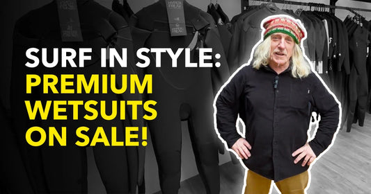 Man in surf shop with premium wetsuits on sale, Welcome Boardstore surf essentials promotion