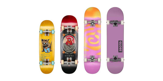 Globe kids and full-size complete skateboards lined up smallest to largest: Softie 83 Micro, Grip 83 Mini, G0 Pond and Goodstock