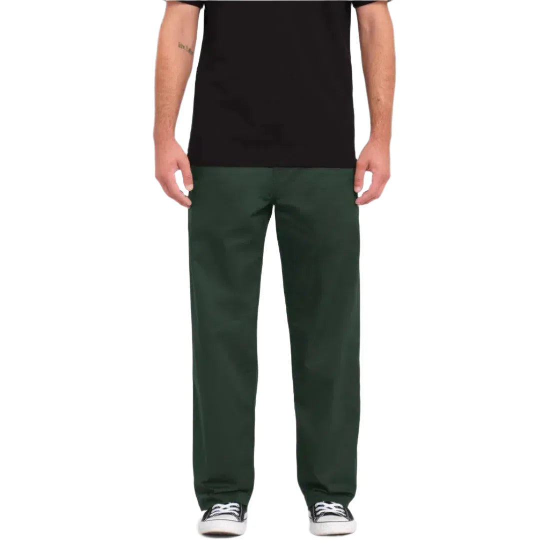 Closeup of black chinos pants worn by person, Welcome Boardstore fashion essentials