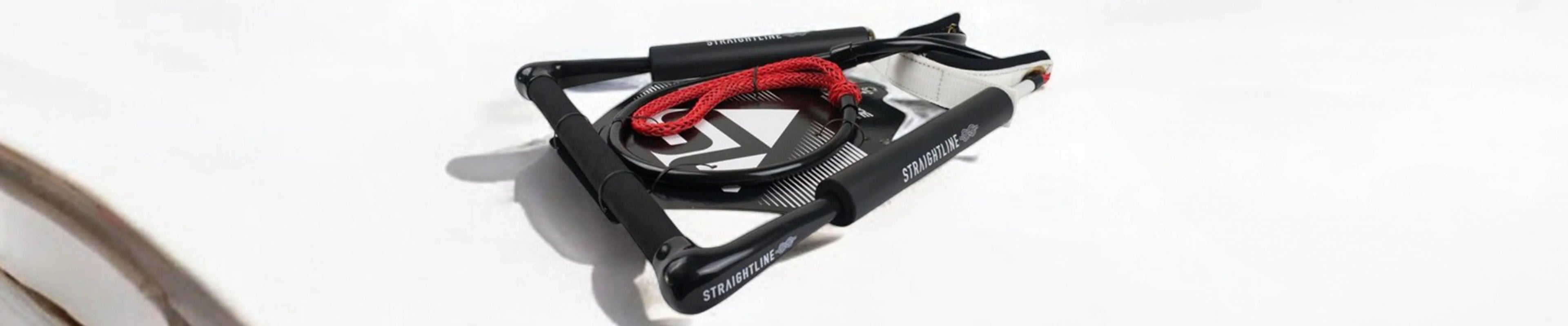 Wakeboard handle and rope set on white background, Straightline brand, Boardstore wakeboarding gear