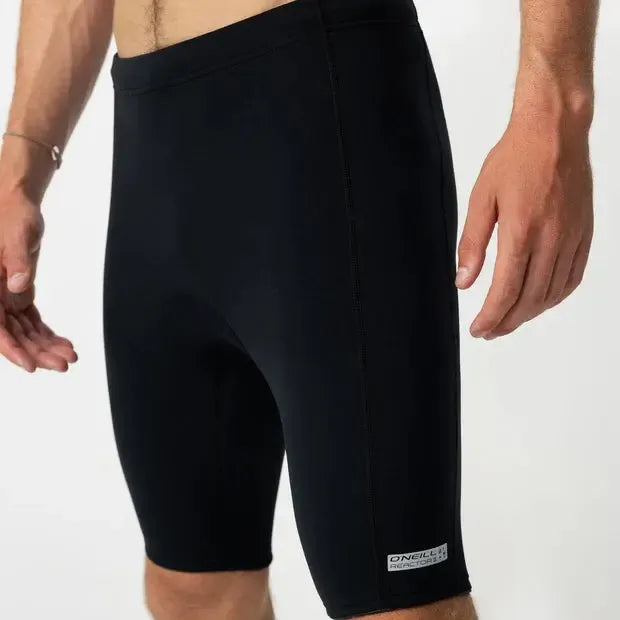 Men's black wetsuit shorts, close-up, ideal for surfing or water sports
