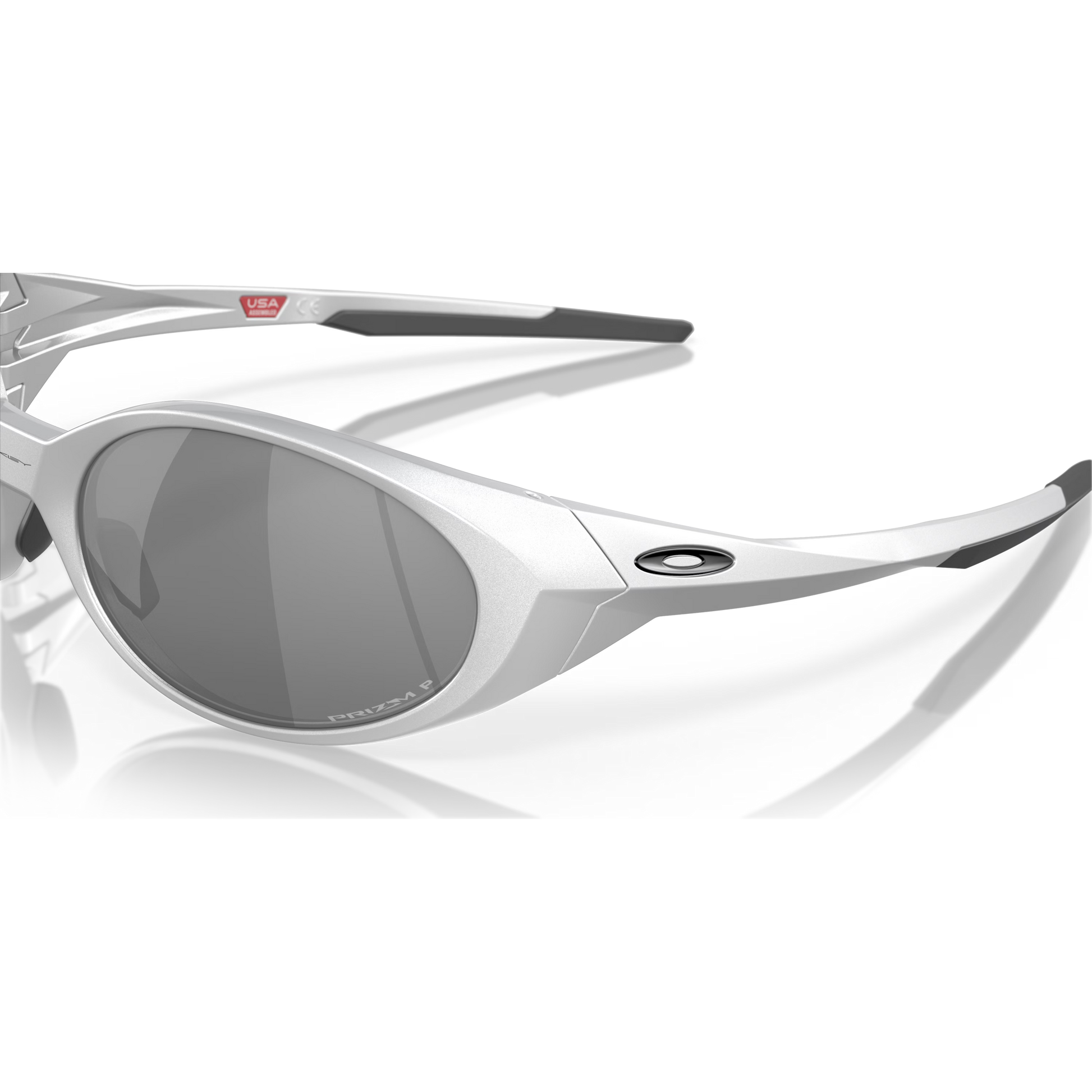 Silver sunglasses with reflective lenses on a black background