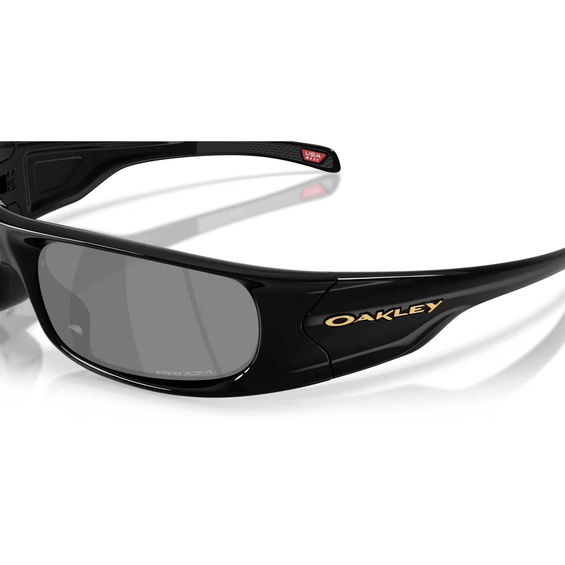 Black Oakley sunglasses with reflective lenses on a clear background