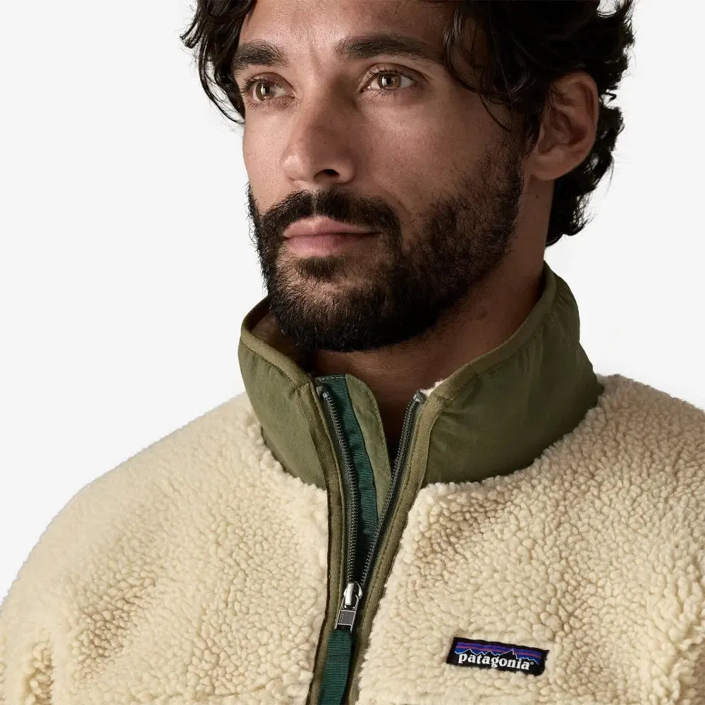 Man wearing a beige fleece jacket with Patagonia logo on a white background welcome boardstore
