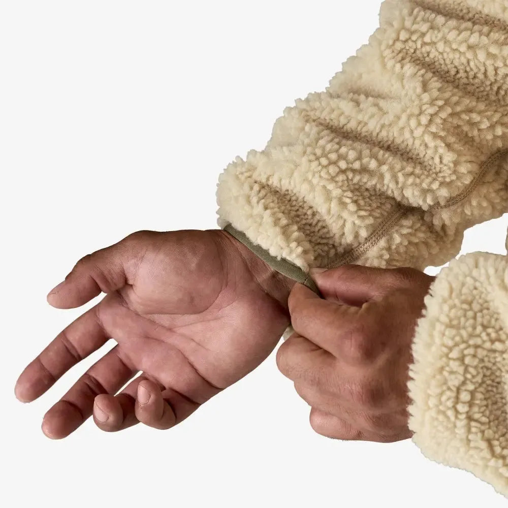 Close-up of a hand wearing a beige fleece-lined glove on a white background welcome boardstore