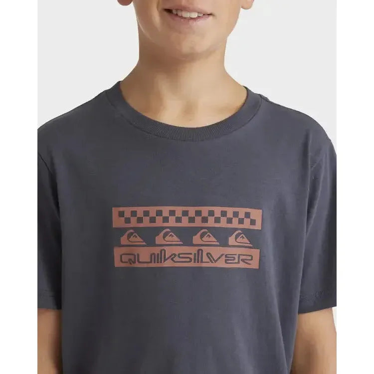 Youth wearing navy surf t-shirt with checkered and geometric chest graphic