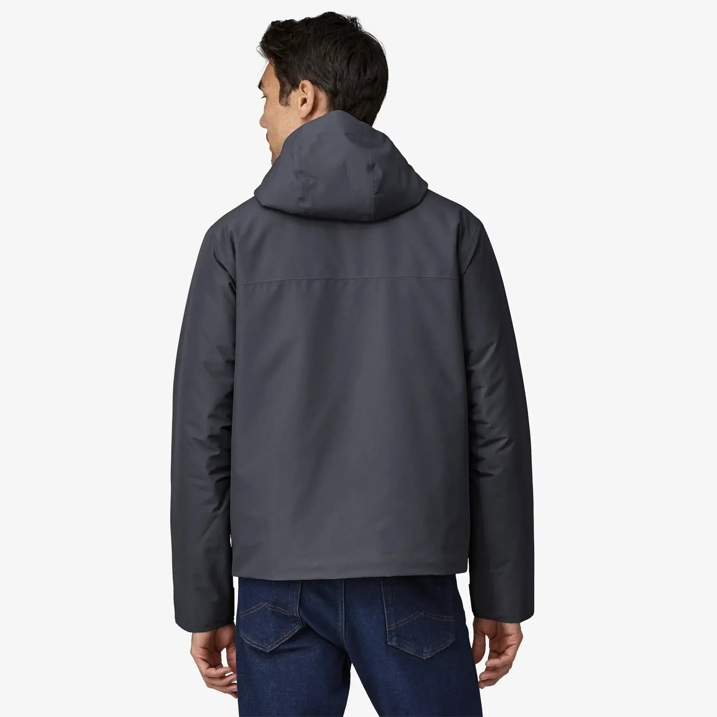 Person wearing a dark gray jacket on a white background