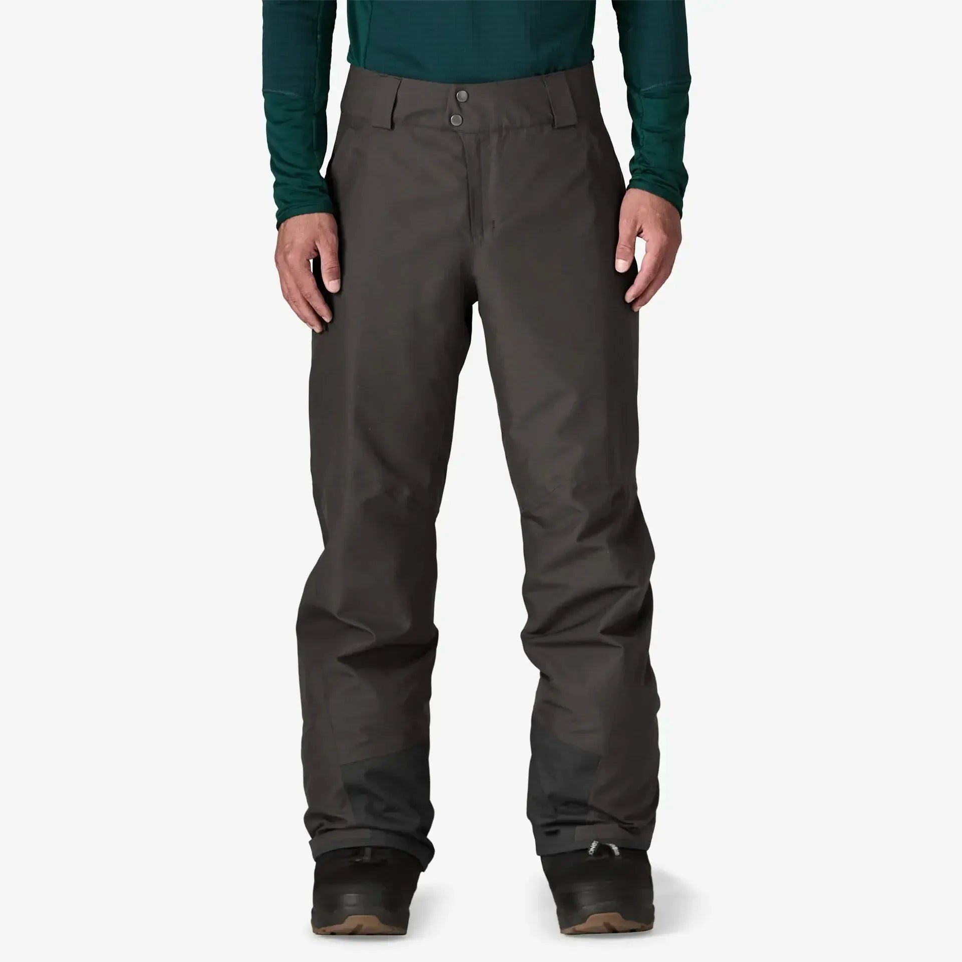 Patagonia Snow Down Dark gray pants worn by a person on a white background