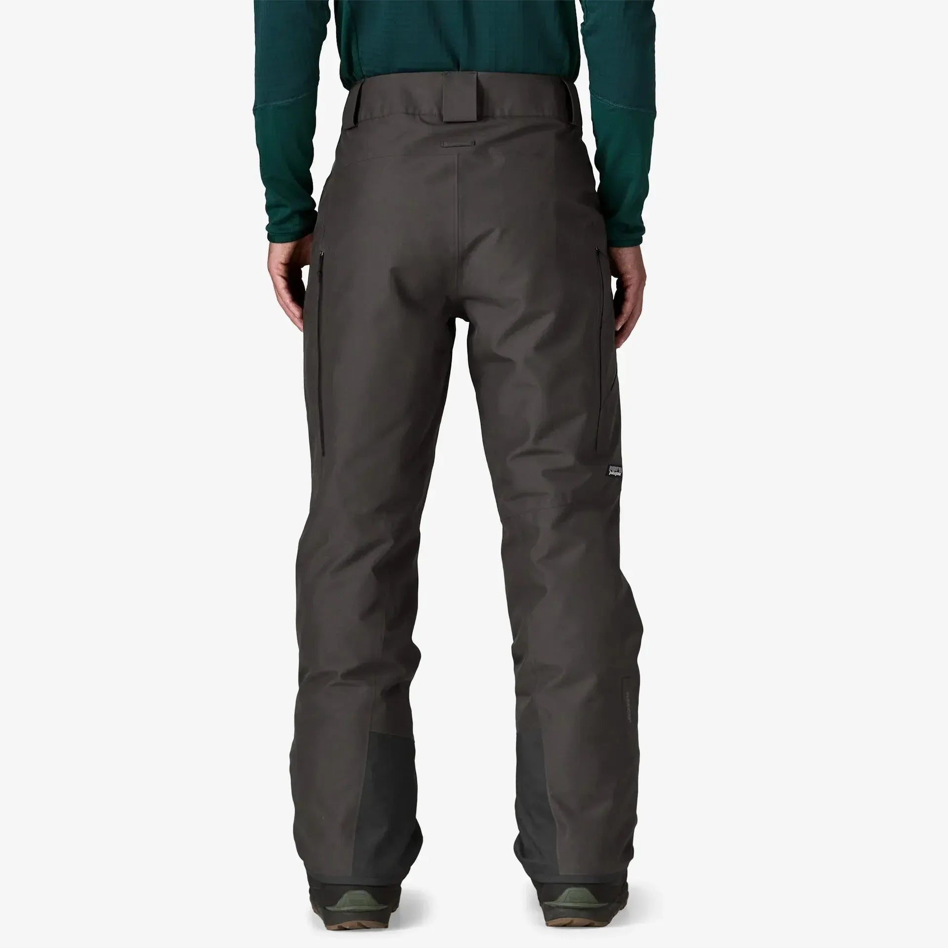 Patagonia Snow Down Dark gray pants worn by a person on a white background