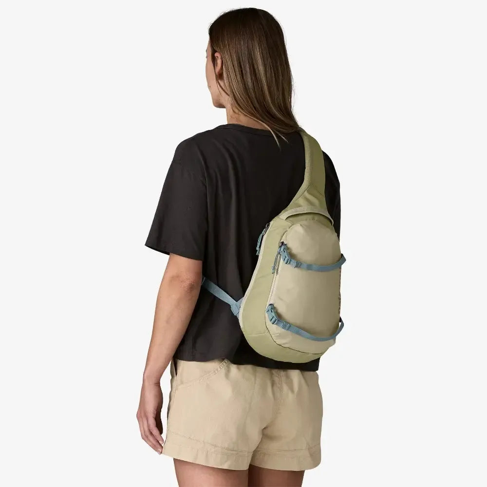 Person wearing a beige sling bag on a white background welcome boardstore