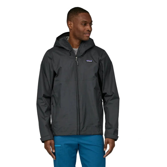 Man wearing a gray rain jacket with a white background