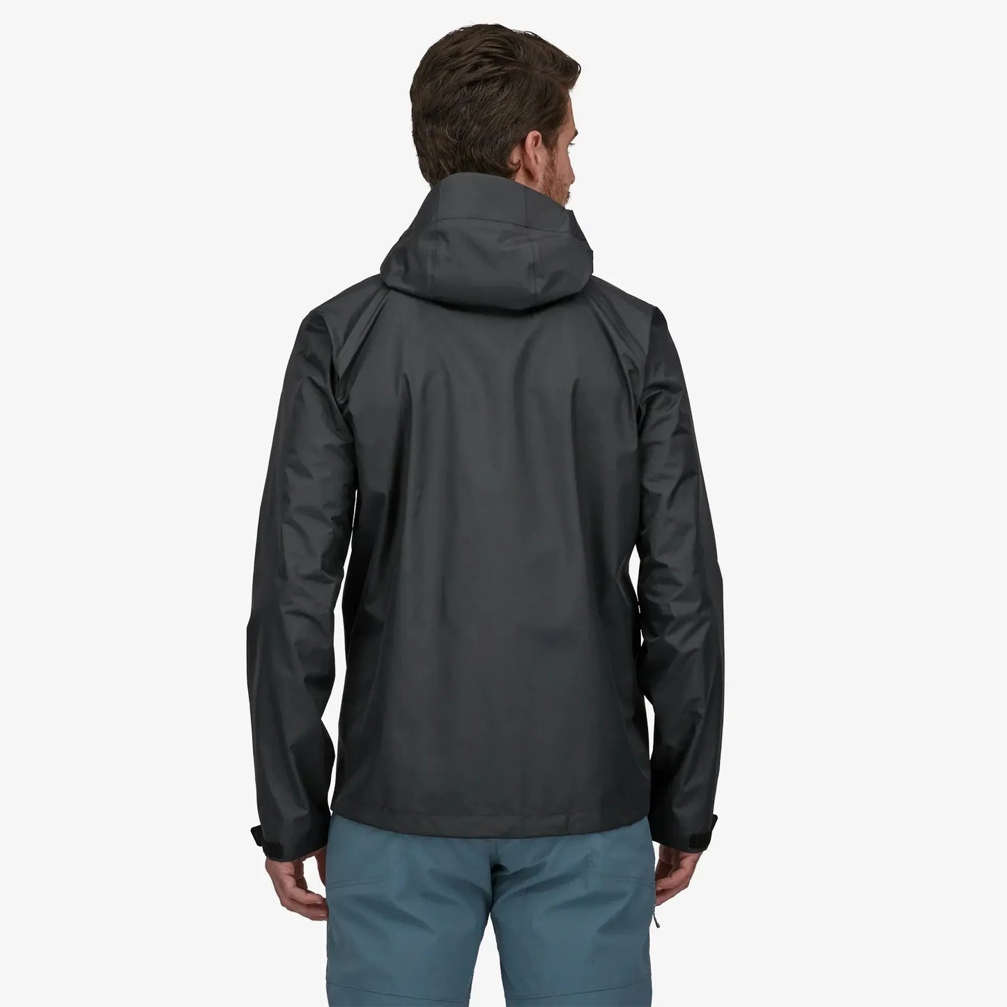 Person wearing a black jacket on a white background