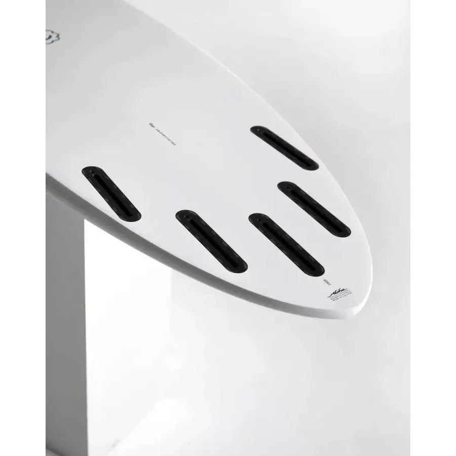 White surfboard tail with multiple black fin slots, surf essentials from Welcome Boardstore