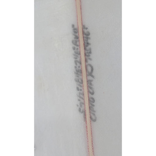 Long thin object with text on a white background