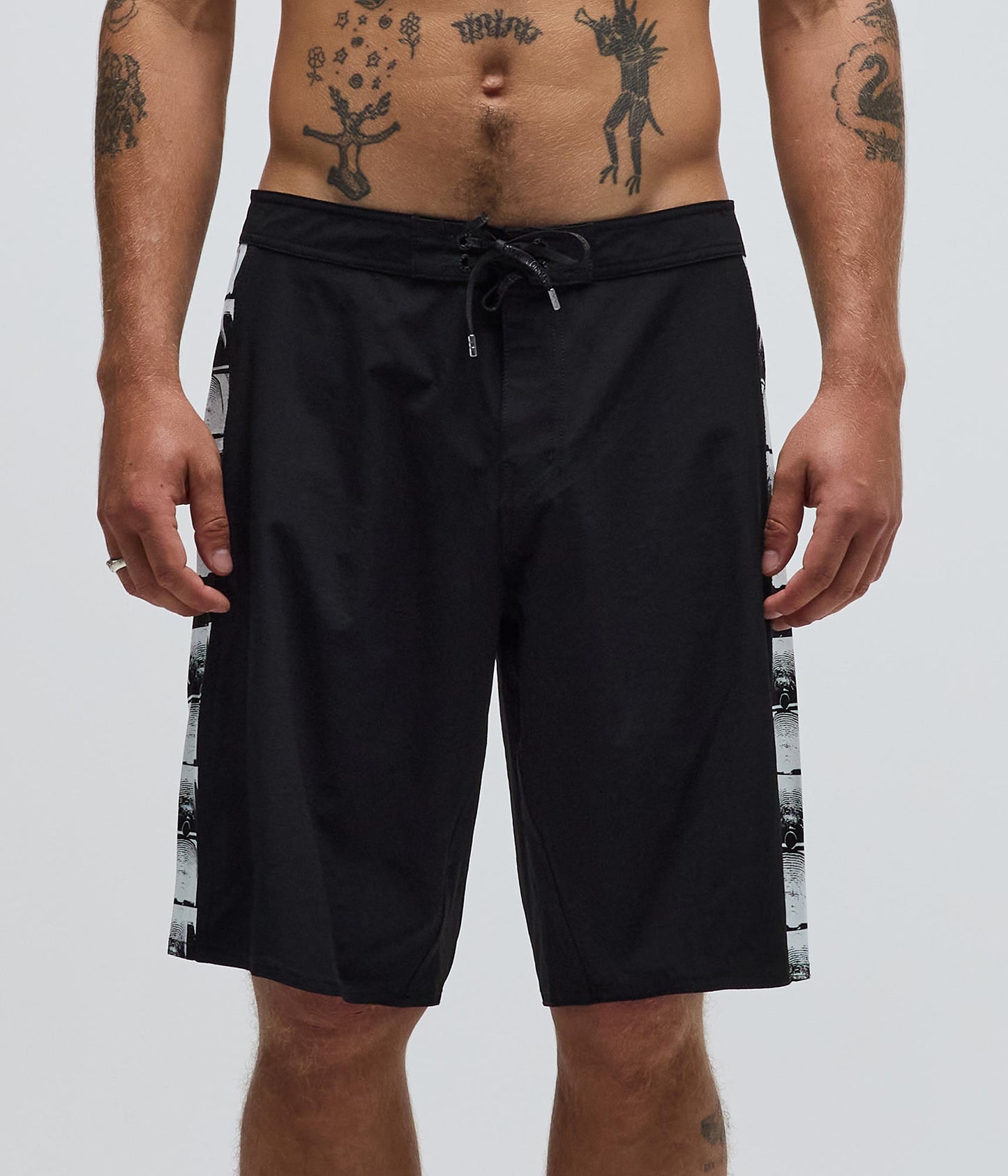Former Team Crux 20" Trunk Black — side panel Crux screenprint detail
