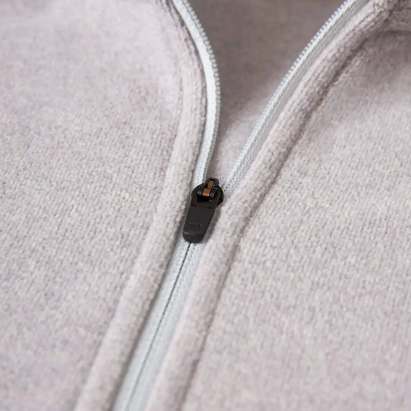 Florence Marine X Polartec Fleece Half Zip Close-up of a zipper on a light gray fleece jacket