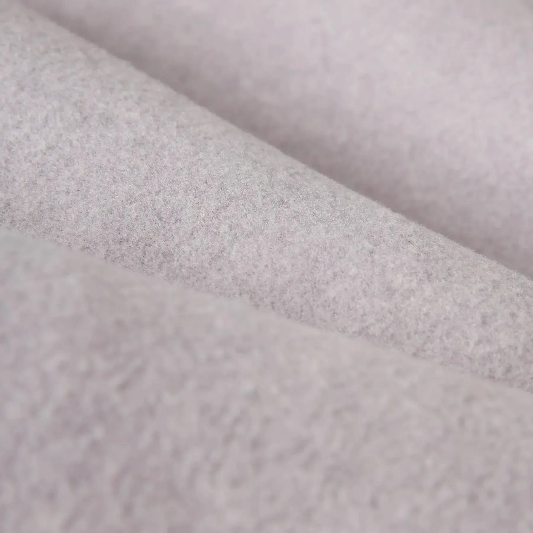 Close-up of gray fabric with a subtle pattern