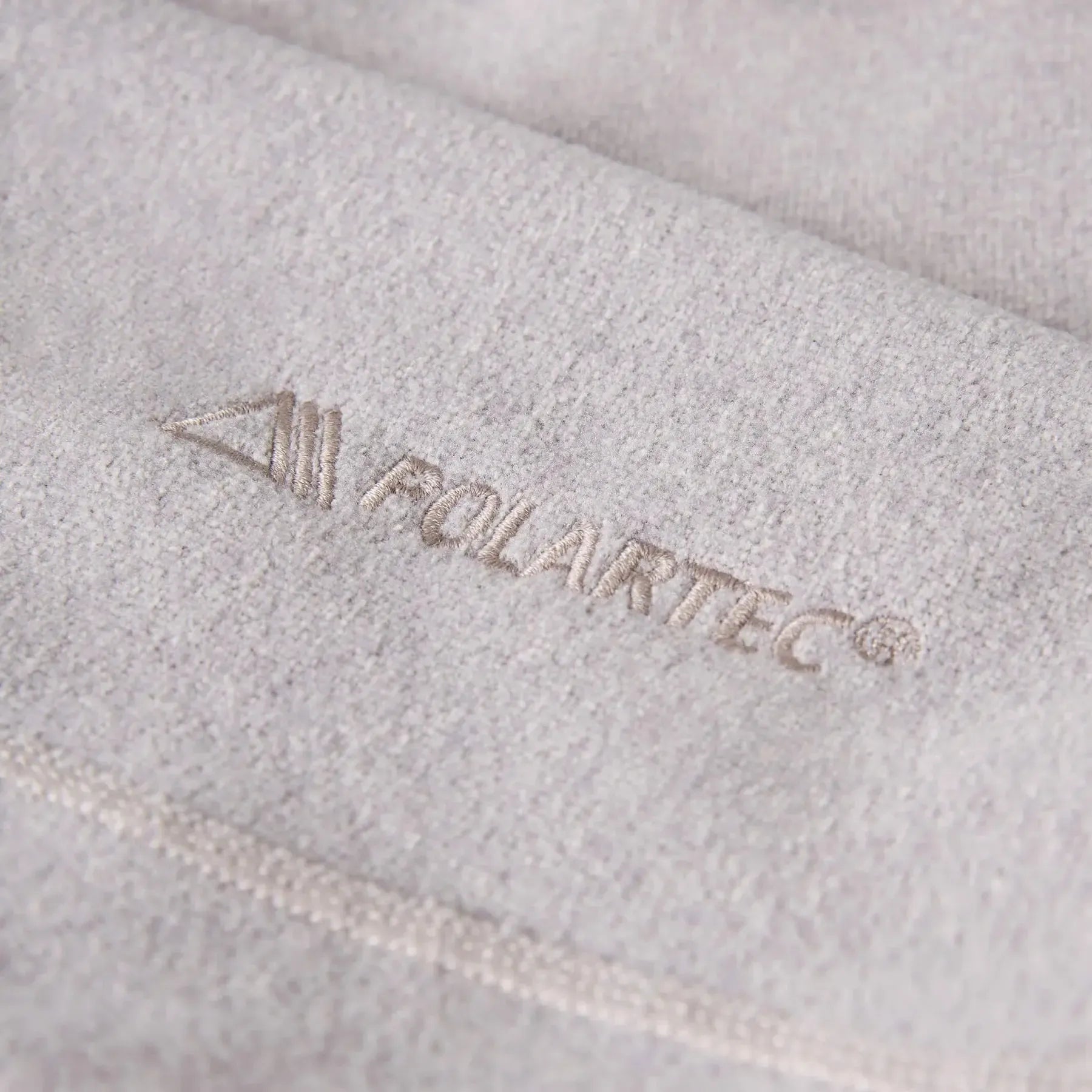 Close-up of a branded product with 'Molairtec' logo on a textured surface.