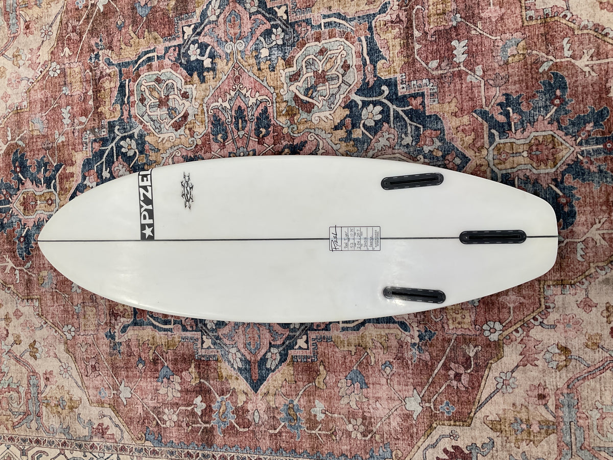 Bottom of white Pyzel Red Tiger pre-loved surfboard with Futures thruster fin boxes
