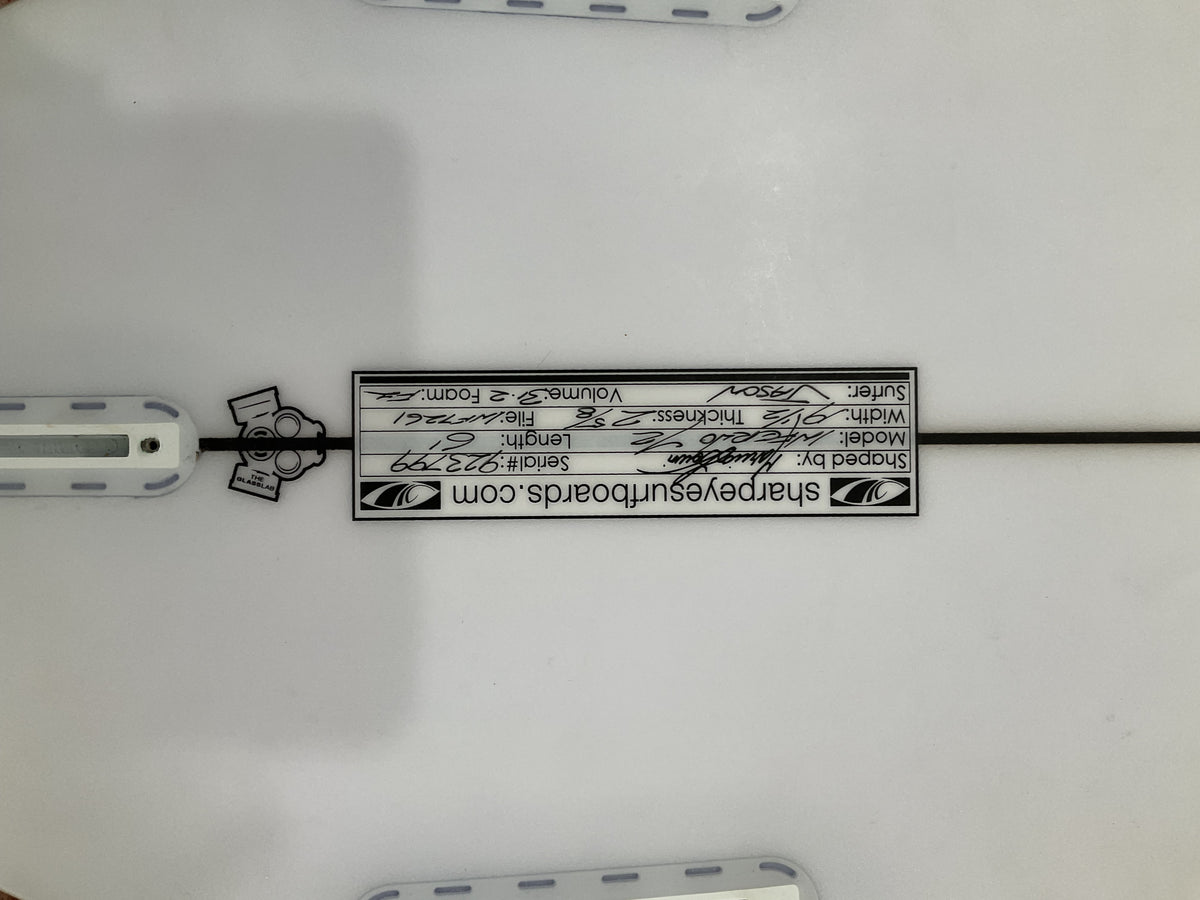 Close-up of the Sharpeye Inferno 72 surfboard dimensions label