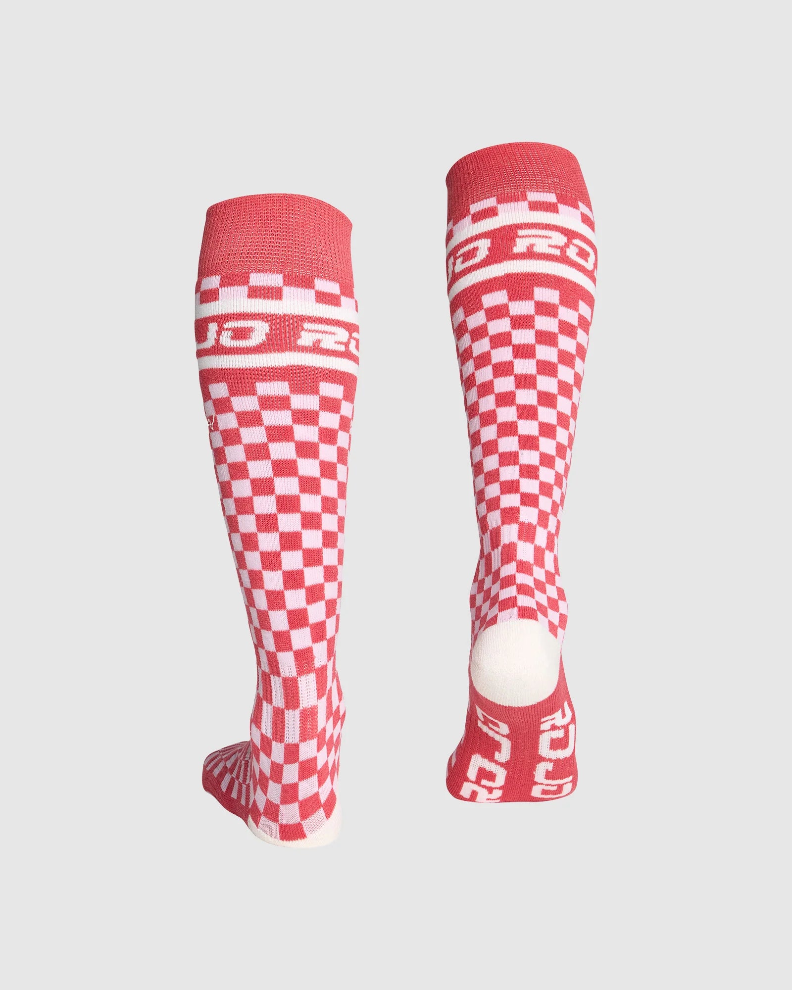 Red and white checkered socks with 'Roces' branding on a light gray background