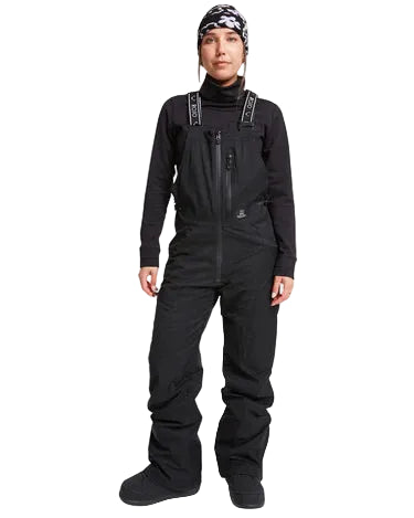 Person wearing a black snowsuit with suspenders on a white background: ALL TERRAIN BIB ROJO