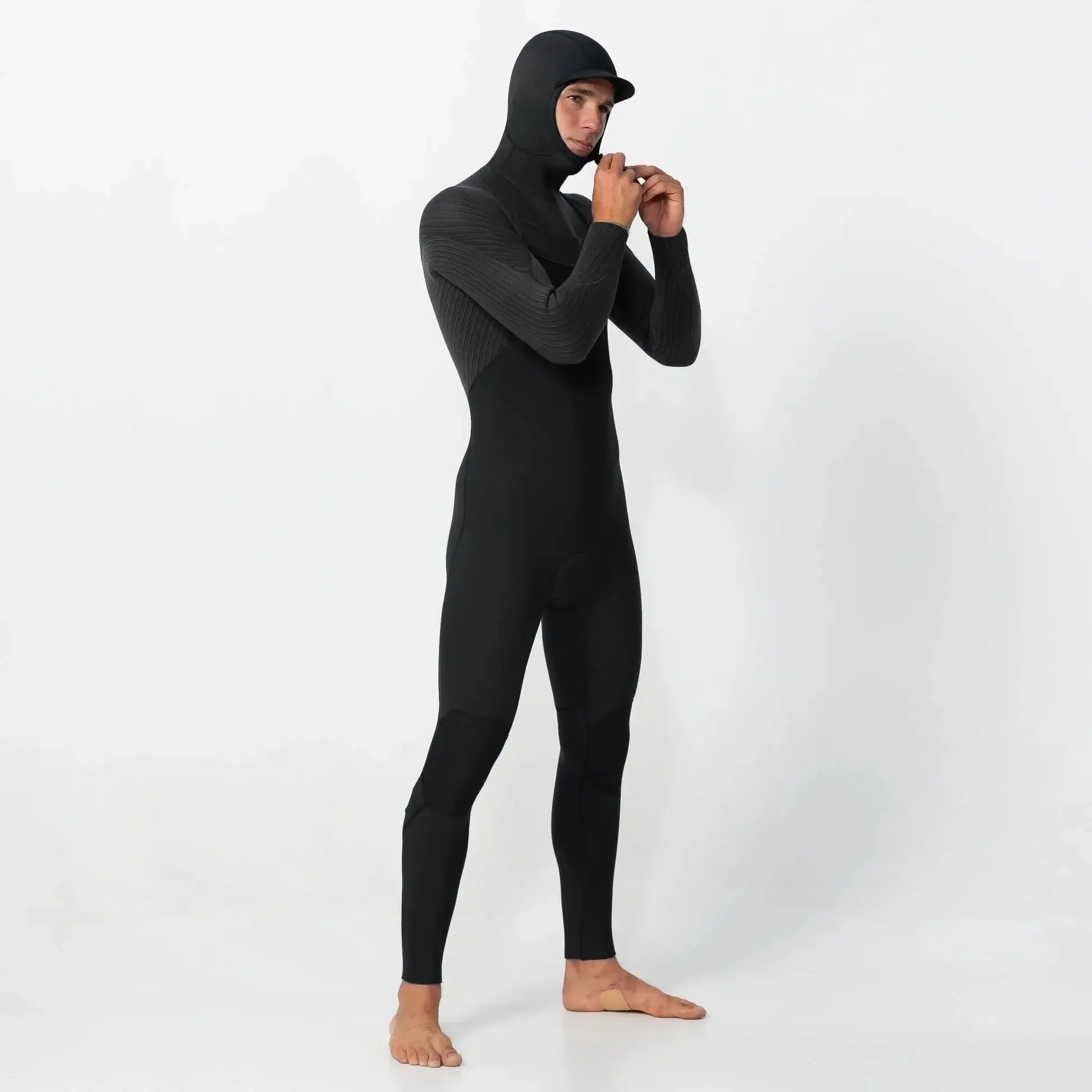 Person wearing a black full-body suit with a hood on a white background