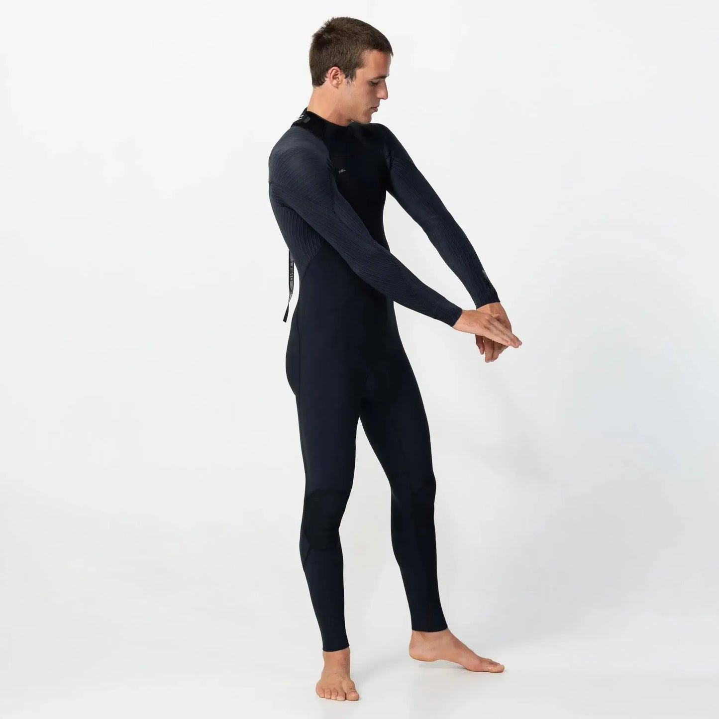 Man wearing a black wetsuit on a white background