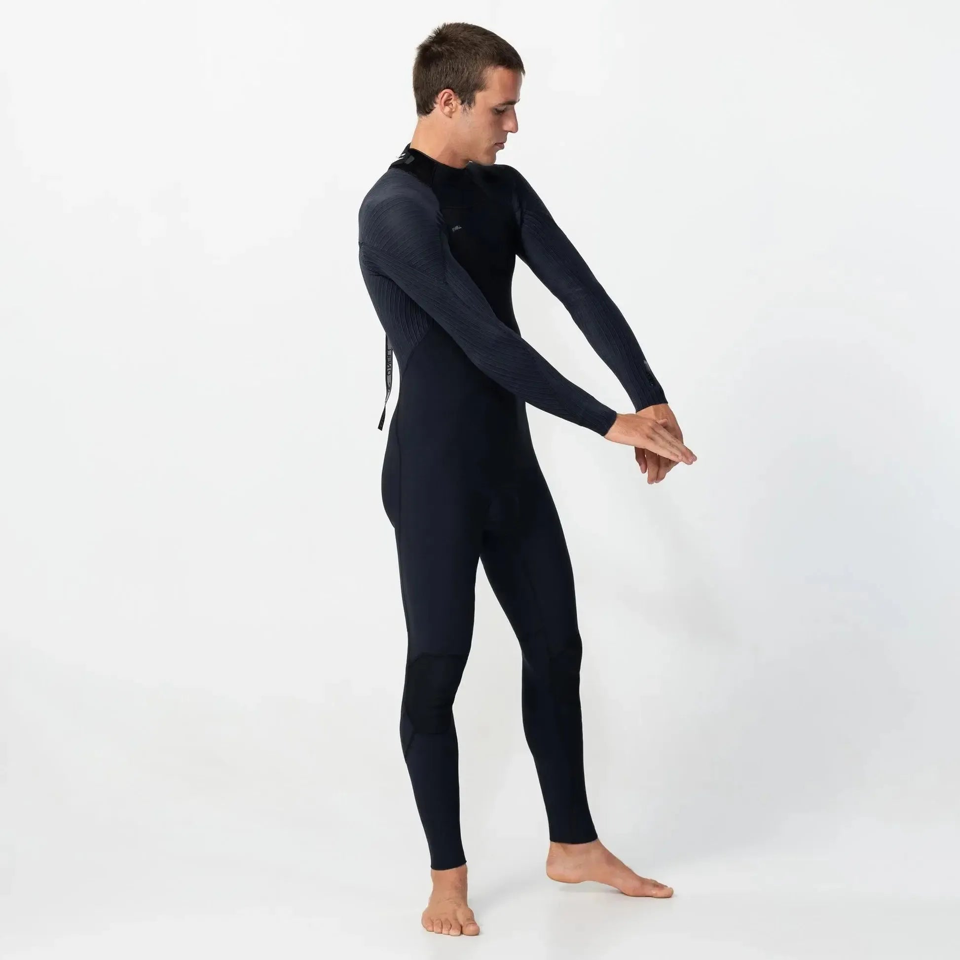 Man wearing a black wetsuit on a white background