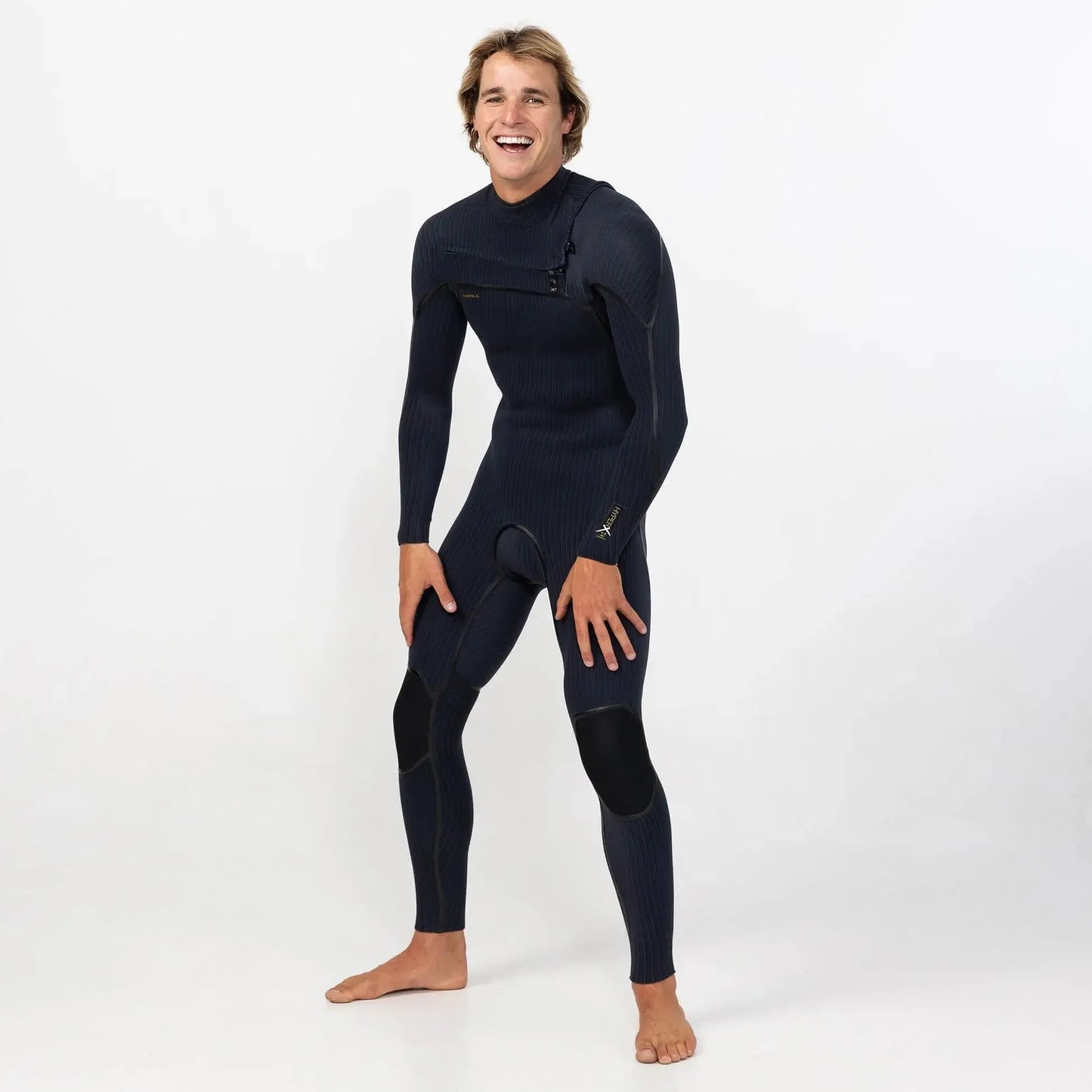 Man wearing black chest zip full-length wetsuit, surf and water sports gear
