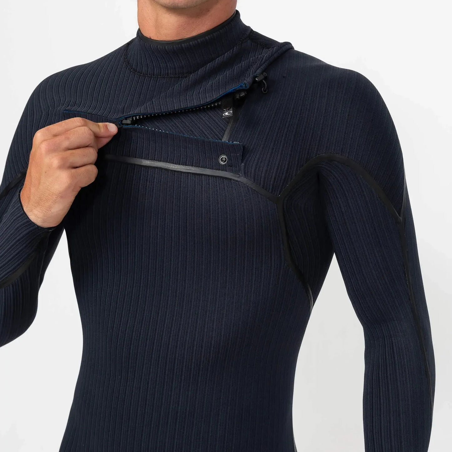 Man wearing black chest zip wetsuit with ribbed texture, opening front zipper