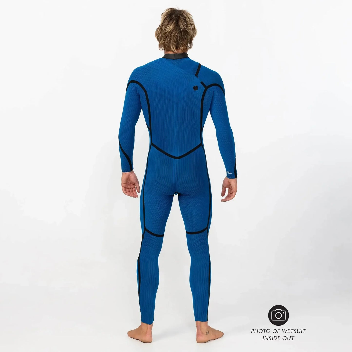 Man modeling blue men's wetsuit inside out, full body rear view against white background