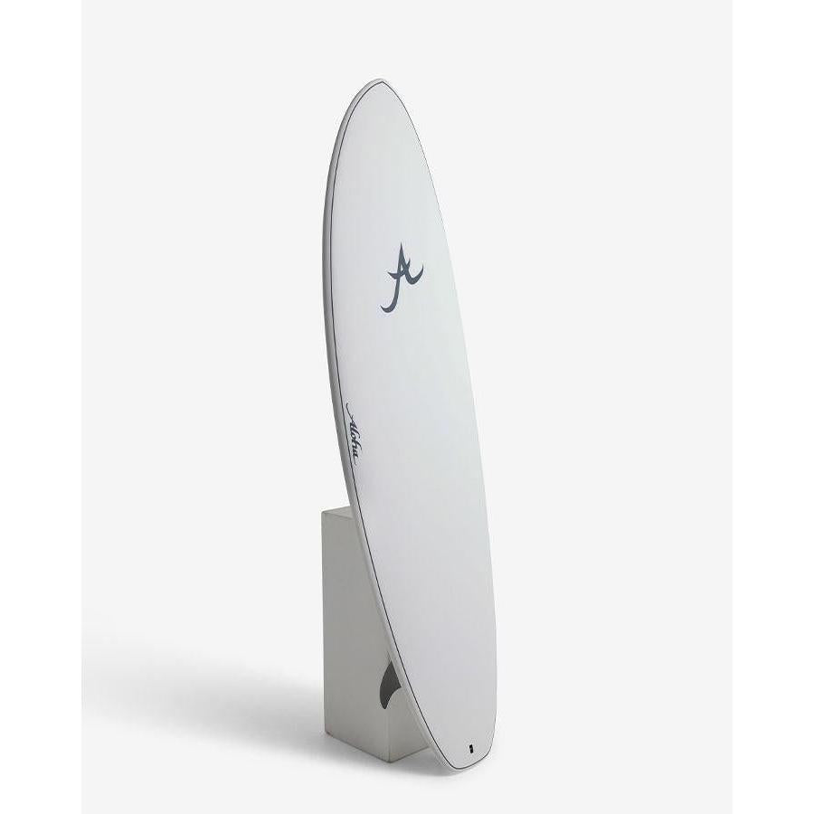 Minimalist white surfboard with black logo, displayed upright against a clean background