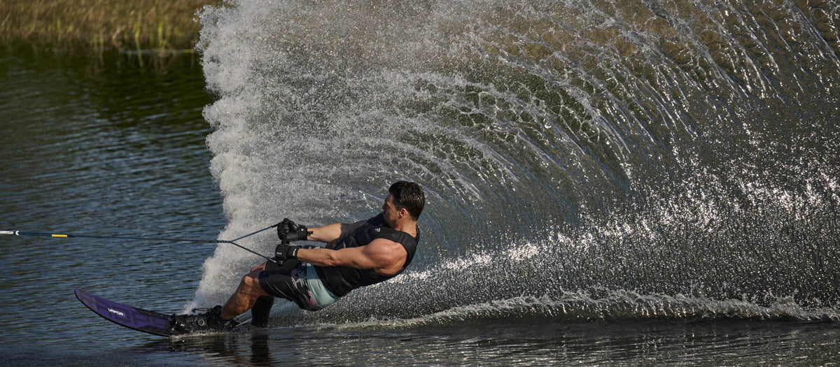 Slalom skier carving a huge spray wall on the 2027 Radar Vapor
