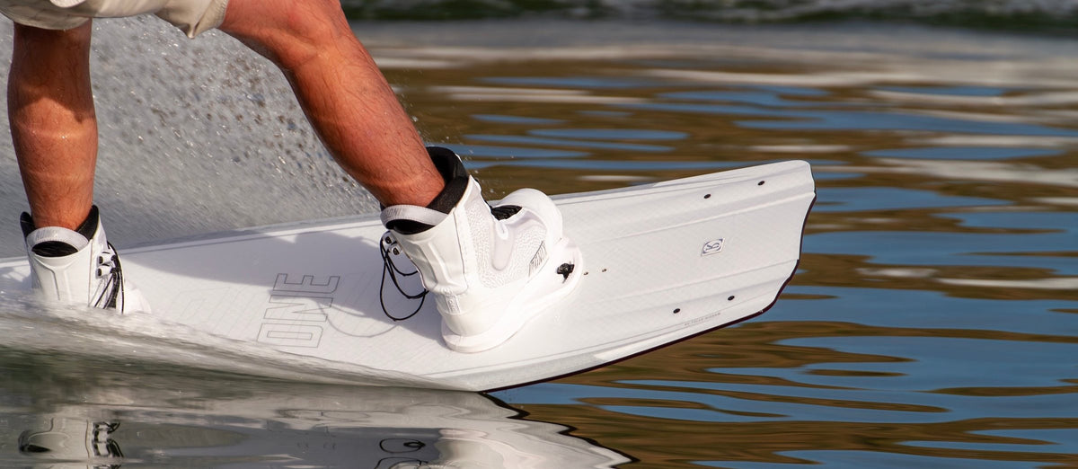 Rider on a 2027 Ronix wakeboard in white Ronix boots